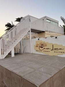 a white staircase on the side of a building at Casa Luna Beach-Front Suite in Dahab
