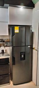 a stainless steel refrigerator in a kitchen at La Pradera in Pereira
