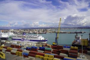 a large ship is docked in a harbor at Hana's Apartment in Durrës