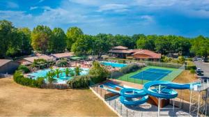 an aerial view of a pool at a resort at Chalet T3 15 min plage grande terasse et piscine in La Teste-de-Buch