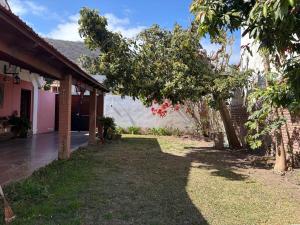 a backyard of a house with a tree at Moon of Salta in Salta