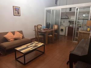 a living room with a couch and a table at Moon of Salta in Salta