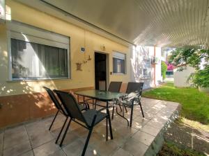 a patio with a table and chairs on a patio at O&A Kallithea in Kallithea Halkidikis +5 photos