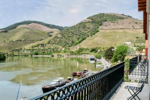a view of a river with boats in it at The Vintage House - Douro in Pinhão