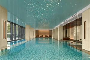 a swimming pool with a star ceiling in a building at Sheraton Suzhou Yangcheng Lake in Suzhou