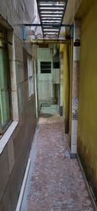 an empty alleyway in an old building at Meu Aconchego in Embu