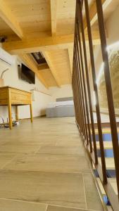 a room with a wooden floor and a piano at Ca Rolina in Camagna Monferrato