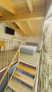 a view of a room with a bed and stairs at Ca Rolina in Camagna Monferrato