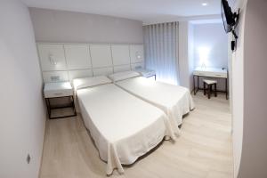 Postel nebo postele na pokoji v ubytování Hostal Loimar + 18 fotografií