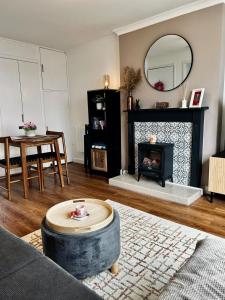 a living room with a couch and a fireplace at Newton Marina View in Stornoway