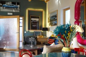 a living room with a table and a couch at Riad Tamayourt Ocean View & piscine chauffée à 30 in Essaouira