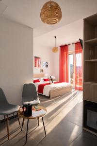 a bedroom with a bed and two chairs at Il Sogno in Como