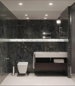 a bathroom with a sink and a toilet at Three Corners Hotel in Skopje +12 photos