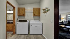 a kitchen with a white stove and a refrigerator at Beach Bum Cabin in Florence +9 photos