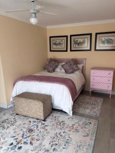 a bedroom with a large bed and a rug at Hyalus House in Vaal Marina +29 photos