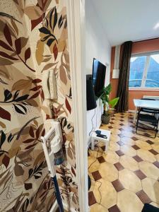 a room with a hair dryer on a wall at Appartement Lumineux 2 in Tourcoing