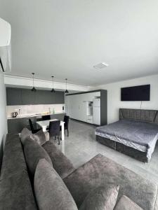 a living room with a couch and a bed at CoyrtYard Longbeach Bölgesi İskele Mersin via 10 Cyprus 99850 TRNC Iskele in Iskele
