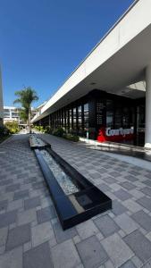 a building with a fountain in front of a building at CoyrtYard Longbeach Bölgesi İskele Mersin via 10 Cyprus 99850 TRNC Iskele in Iskele