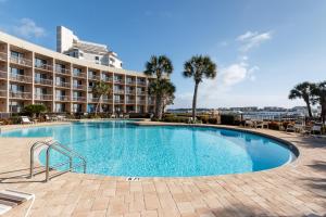 a large swimming pool in front of a hotel at Pirates Bay A108 in Fort Walton Beach