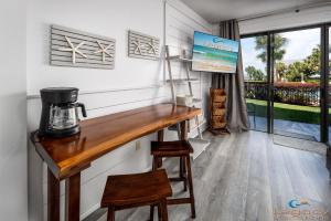 a room with a counter with a coffee maker on it at Pirates Bay A108 in Fort Walton Beach