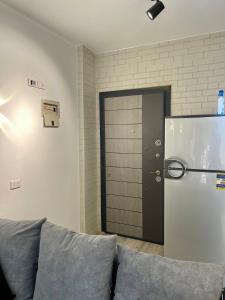 a living room with a couch and a refrigerator at Ras Sedr in Ras Sedr +8 photos