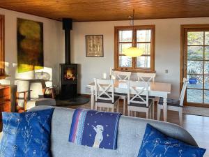 a living room with a couch and a dining room at 4 person holiday home in Aars-By Traum in Års