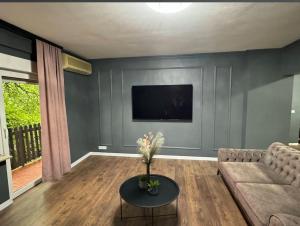 a living room with a couch and a tv at Villa Luxury Crystal center in Bihać +8 photos