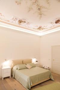 A bed or beds in a room at Il Leone Blu