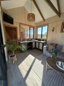 a living room with a couch and a table at Mountain Range Guesthouse in Dovedale