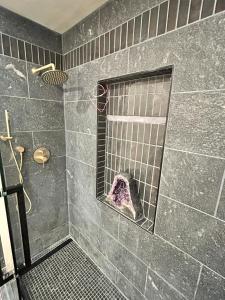 a bathroom with a shower with a window at Kit Inn Wetrock in Moab