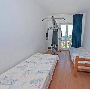 a hospital room with two beds and a simulator at Holiday Home Ivanino in Dubrovnik