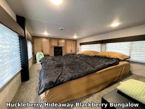 a bedroom with a large bed in a room at Huckleberry Hideaway in Minden