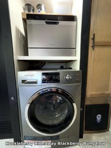 a washer and dryer in a small room at Huckleberry Hideaway in Minden +46 photos