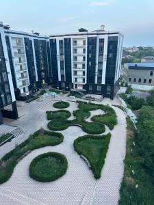 an aerial view of a large building with a garden at White Guest House in Samarkand