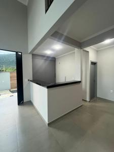 an empty room with a counter in a building at Pousada Vila Palmital in Paraty