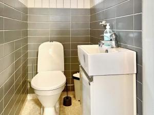 a bathroom with a toilet and a sink at 8 person holiday home in Mönsterås in Mönsterås +19 photos