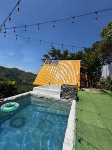 a swimming pool in a yard with a house at Casa Mostaza-Ecolodge in Samaná +35 photos