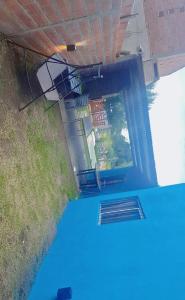 an overhead view of the inside of a building with a blue floor at Cande in Parana