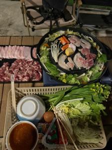 a table with a bunch of food on it at อามา ภูลังกา เฮาส์ in Ban Sakoen +39 photos