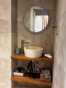 a bathroom with a sink and a mirror at The Hidden Heaven in Chios