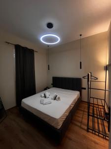 a bedroom with a bed with a light on it at The Hidden Heaven in Chios