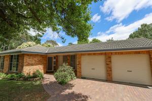a brick house with two garage doors at Linden Getaway Bowral in Bowral
