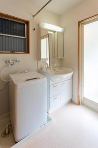 a bathroom with a sink and a mirror at 野町 庵 in Kanazawa +22 photos