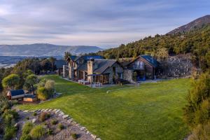 an aerial view of a house on a hill at Lake Hawea View in Albert Town