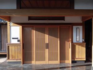 a large room with wooden doors in a building at やぎみちの家 yagimichi-noie in Sasebo +24 photos