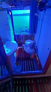 a small bathroom with a toilet and a sink at Check beth in Puerto Princesa City