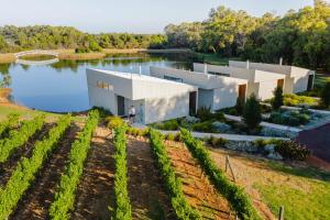 an aerial view of a house with a lake at Edge Luxury Villas in Wilyabrup