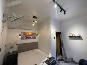 a room with a couch and a painting on the wall at Z&Z Budget Room in Kampung Kuala Besut +31 photos