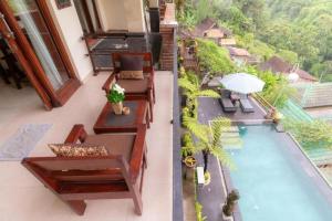 an image of a balcony with a swimming pool at Secret Forest Hideaway near Ubud in Bangli