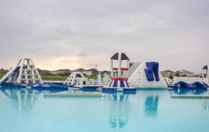a water park with a water slide in the water at South Shore Suites in Wimauma